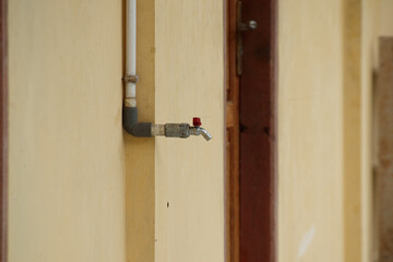 photo of a water tap on the terrace of a school