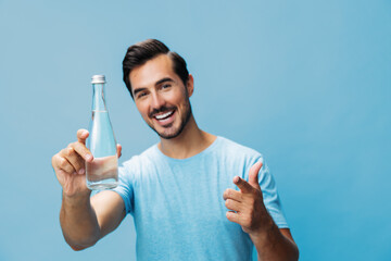 Man studio lifestyle water bottle happy smile sport healthy drink portrait attractive t-shirt