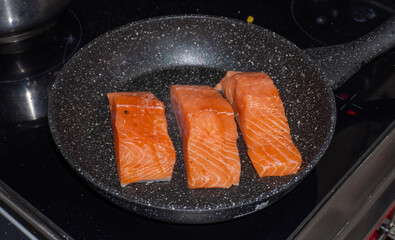 Cooking salmon steaks in the pan