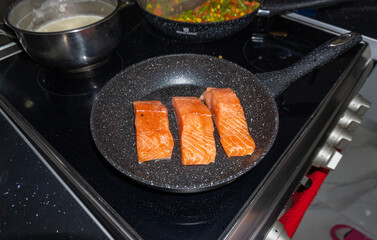 Cooking salmon steaks in the pan