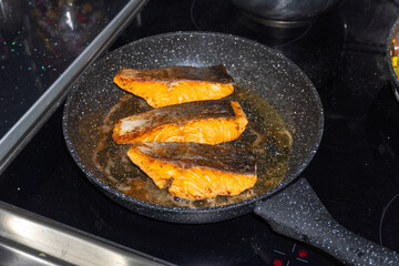 Cooking salmon steaks in the pan