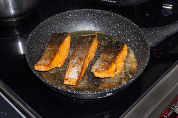 Cooking salmon steaks in the pan
