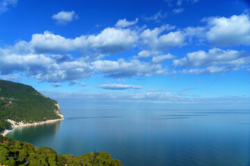 seaside ocean landscape clouded with a distant blue horizon