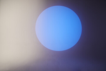 Blue spot light on white background, abstract geometric background.