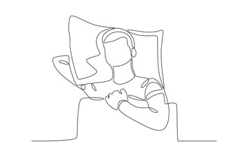 A man sleeps with his hand under his pillow