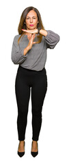 Beautiful middle age business woman Doing time out gesture with hands, frustrated and serious face