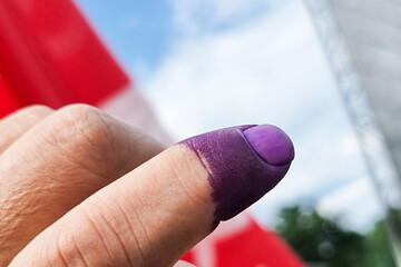 Closeup of purple indelible ink on index finger. Used in election in Malaysia to prevent fraud.