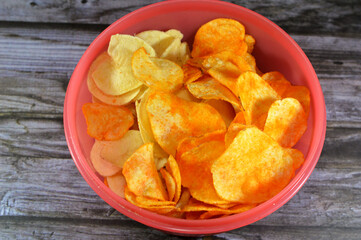 Potato chips, crisps, thin slices of potato,  deep fried, baked, or air fried until crunchy, served...
