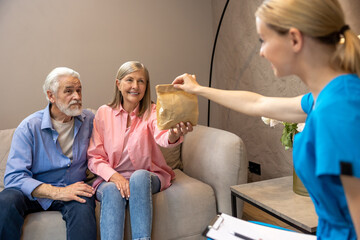 Mature couple have consultation with doctor.