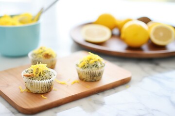 Obraz na płótnie Canvas lemon poppy seed muffins with lemon zest topping