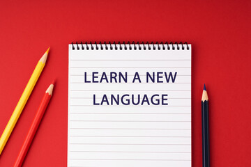 Notepad with text Learn a New Language