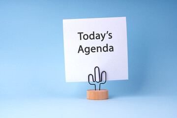 White paper note with text Today's Agenda