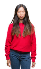 Young asian woman wearing winter sweater over isolated background depressed and worry for distress, crying angry and afraid. Sad expression.