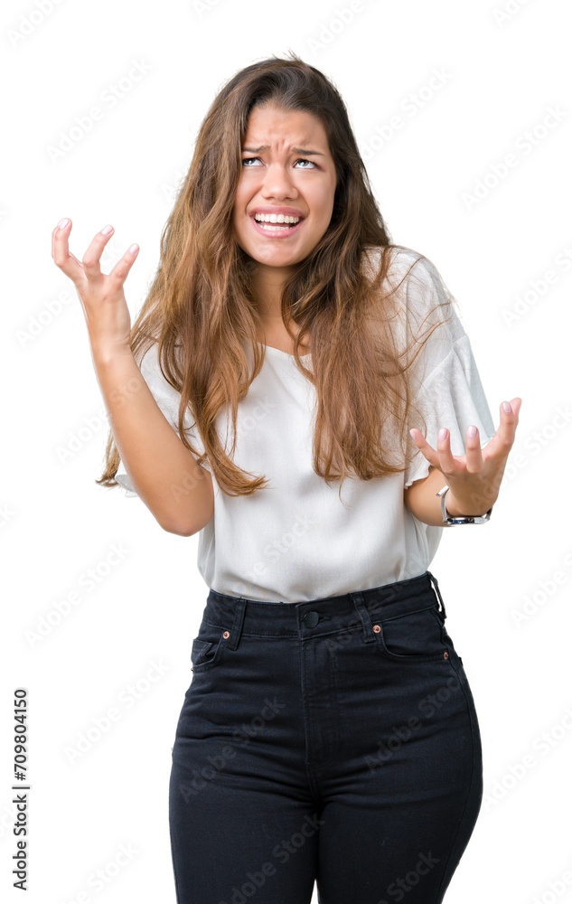 Canvas Prints Young beautiful brunette business woman over isolated background crazy and mad shouting and yelling with aggressive expression and arms raised. Frustration concept.