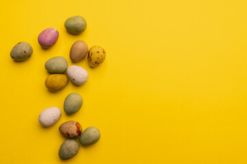 Easter Palette: A Spectrum of Speckled Eggs on Yellow