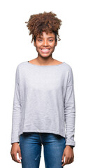Beautiful young african american woman over isolated background with a happy and cool smile on face. Lucky person.