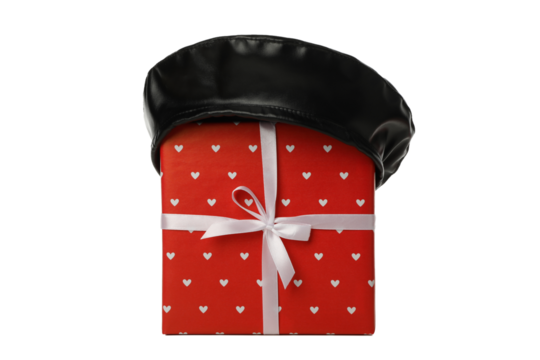 PNG of a gift with a French beret isolated on a white background. - Powered by Adobe