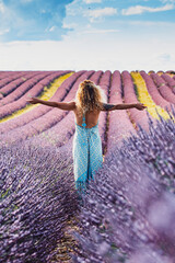 Happy and free traveler woman outstretching arms and enjoy amazing nature landscape in the middle...