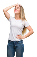 Beautiful young woman wearing t-shirt and jeans stressed with hand on head, shocked with shame and surprise face, angry and frustrated. Fear and upset for mistake.