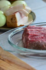 Raw beef on a cutting board ready to be cooked in the oven