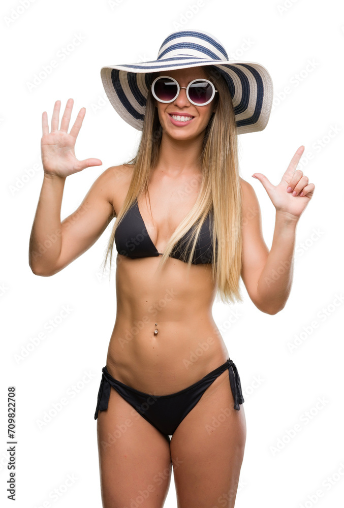 Sticker beautiful young woman wearing bikini, sunglasses and hat showing and pointing up with fingers number