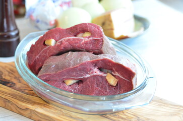 Raw beef on a cutting board ready to be cooked in the oven