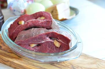 Raw beef on a cutting board ready to be cooked in the oven