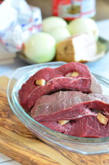 Raw beef on a cutting board ready to be cooked in the oven
