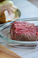 Raw beef on a cutting board ready to be cooked in the oven