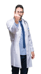 Handsome young doctor man over isolated background Showing middle finger, impolite and rude fuck...