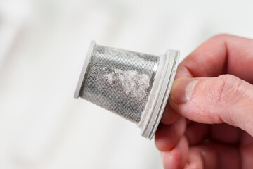 Vacuum cleaner dust filter after cleaning apartment with dusty particles