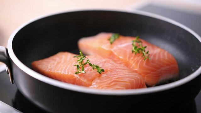 Pan-fried Salmon. Cooking salmon in a pan.