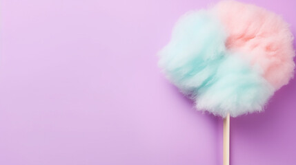 stick with yummy cotton candy on lilac background