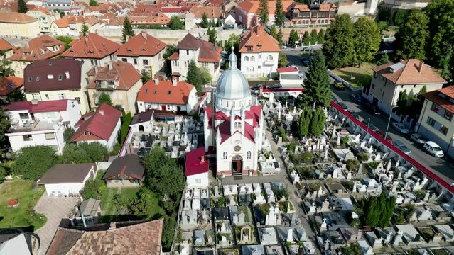 Drone footage of the Orthodox Church of St. Paraskeva and Schei Cemetery in Brasov, Romania