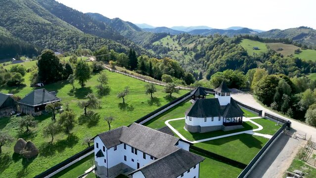 Drone footage of Bran Monastery (Manastirea Bran) on a sunny day in Strada Balaban, Simon, Romania