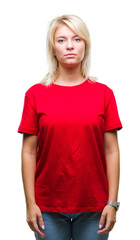 Fototapeta premium Young beautiful blonde woman wearing red t-shirt over isolated background with serious expression on face. Simple and natural looking at the camera.