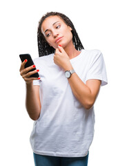 Fototapeta premium Young braided hair african american girl showing using smartphone over isolated background serious face thinking about question, very confused idea