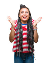 Young braided hair african american girl over isolated background celebrating crazy and amazed for success with arms raised and open eyes screaming excited. Winner concept