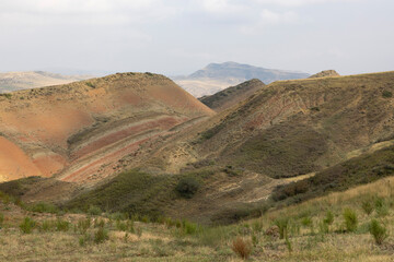 Landscape of Kakheti region in eastern Georgia with dry meadows and sandstone mountains