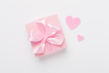 Gift box with hearts on color background, top view. Valentines day concept
