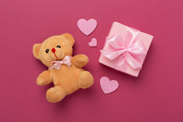 Valentines day composition with gifts on color background, top view.