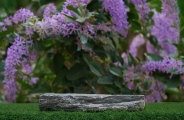 Stone tabletop podium floor in outdoors with blurred purple wreath flower forest plant nature background.Natural product perfume placement pedestal stand display,spring blooming concept.
