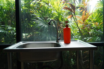 Washing hand healthy area in house garden.