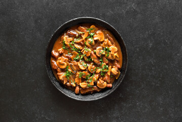 Beef stroganoff with mushrooms in frying pan