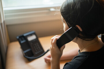 Close-up of a girl talking on the phone, receptionist.