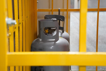 Propane gases are isolated and stored in cages.