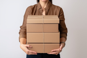 woman holding cardboard boxes