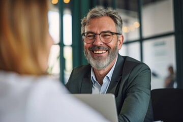 Smiling middle aged mature older business man hr manager, lawyer, bank adviser having work conversation at office meeting or job interview. Financial legal advisory and consultancy, Generative AI
