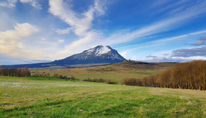 beautiful meadow landscape with a mountain