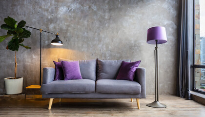 Grey sofa with violet pillow and floor lamp against concrete wall with copy space. Loft home interior design of modern living room.